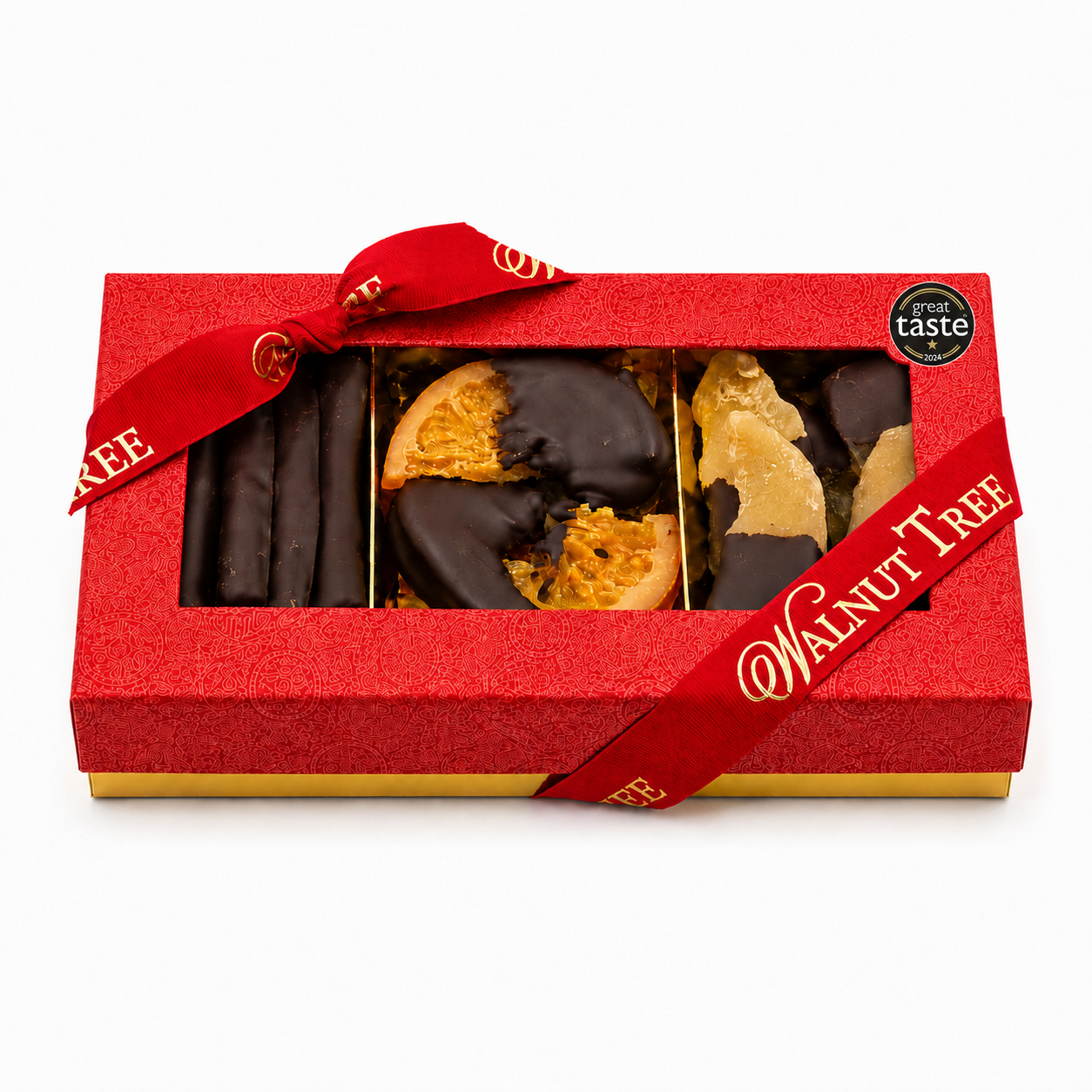Walnut Tree luxury medium gift box featuring chocolate-dipped orange slices and assorted candied fruits, presented in a red gift box with gold Walnut Tree ribbon and Great Taste award badge, against a warm festive Christmas background.