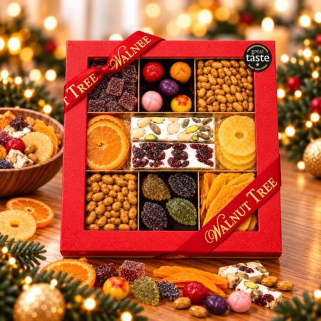 Walnut Tree luxury nine-compartment confectionery gift box featuring an assortment of premium sweets and treats, presented in red packaging with gold ribbon against a warm festive Christmas background.