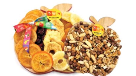 Luxury dried fruit and nut gift on apple carved serving board