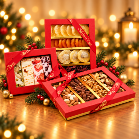 Walnut Tree luxury Christmas gift hamper featuring premium mixed nuts, dried fruits and assorted nougat in red and gold gift boxes, displayed with festive greenery and gold ornaments on a white background.