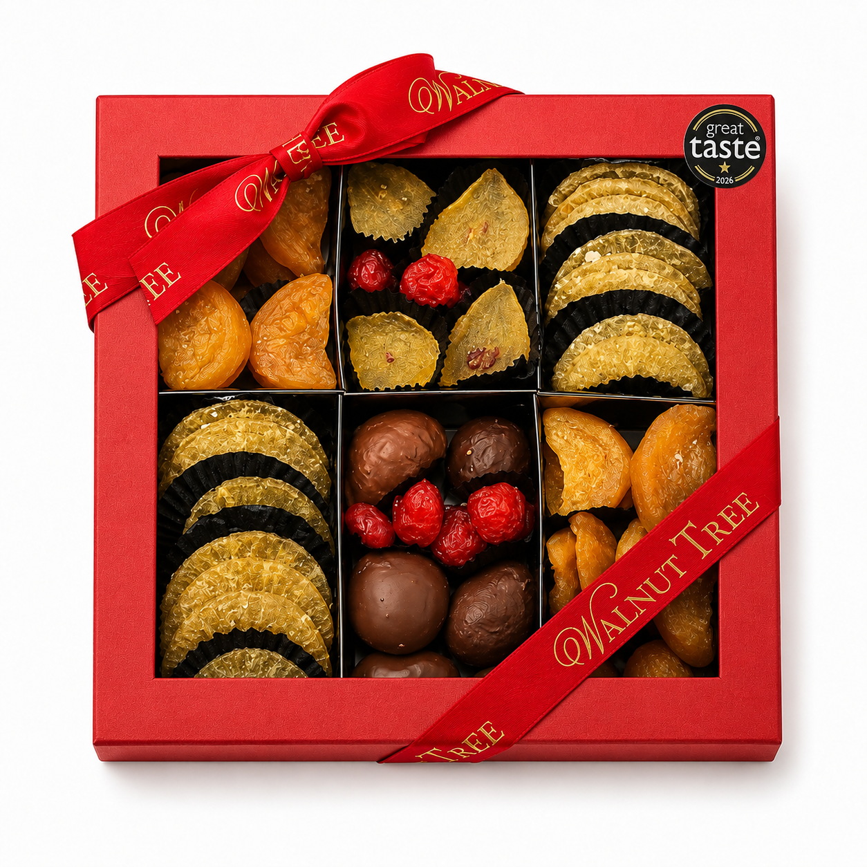 Walnut Tree luxury nine-compartment glacé fruit gift box featuring assorted candied citrus slices and colourful glacé fruits, presented in red packaging with gold ribbon and Great Taste award badge against a festive Christmas background.