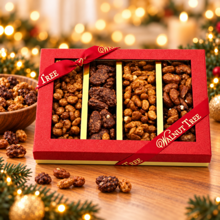 Walnut Tree Striped Nuts luxury gift box with four compartments of assorted coated nuts, red gift packaging and gold ribbon, displayed with festive Christmas lights.