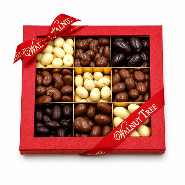 Assorted chocolate covered nuts in a nine-section Walnut Tree gift box